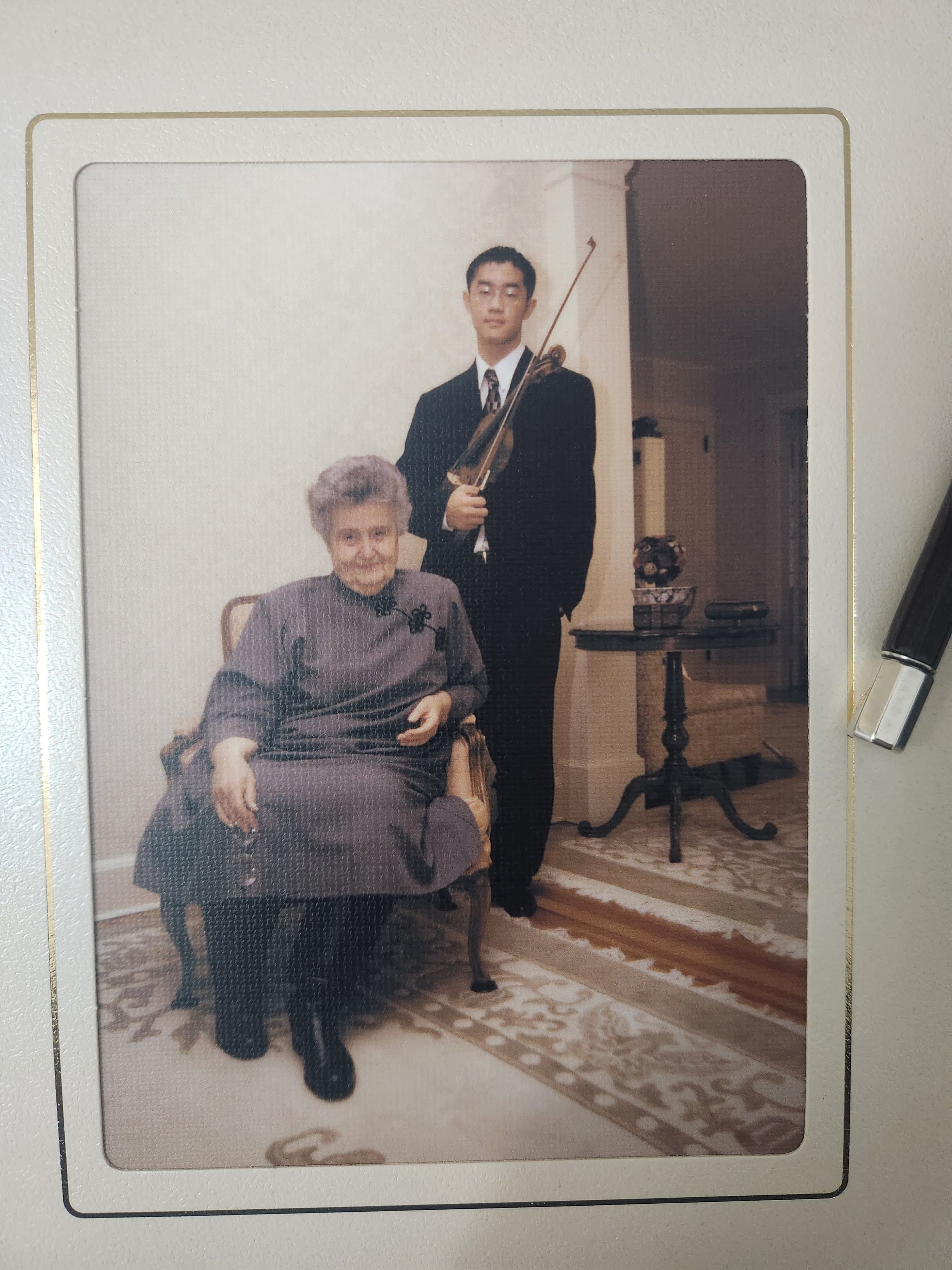 Baek Kim at age 16 standing with his violin beside Dorothy DeLay